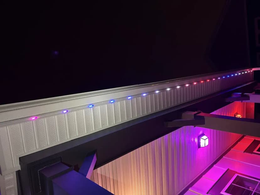 Permanent RGB LED trim lighting on a soffit running a red, white & blue program — LightDMV