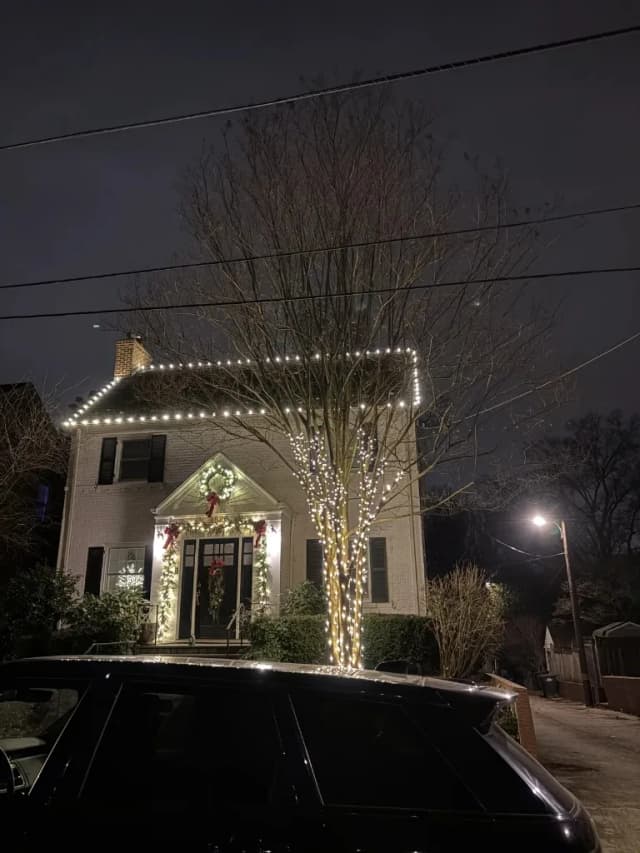 Christmas light installation in the DMV — warm white install with front-yard decor