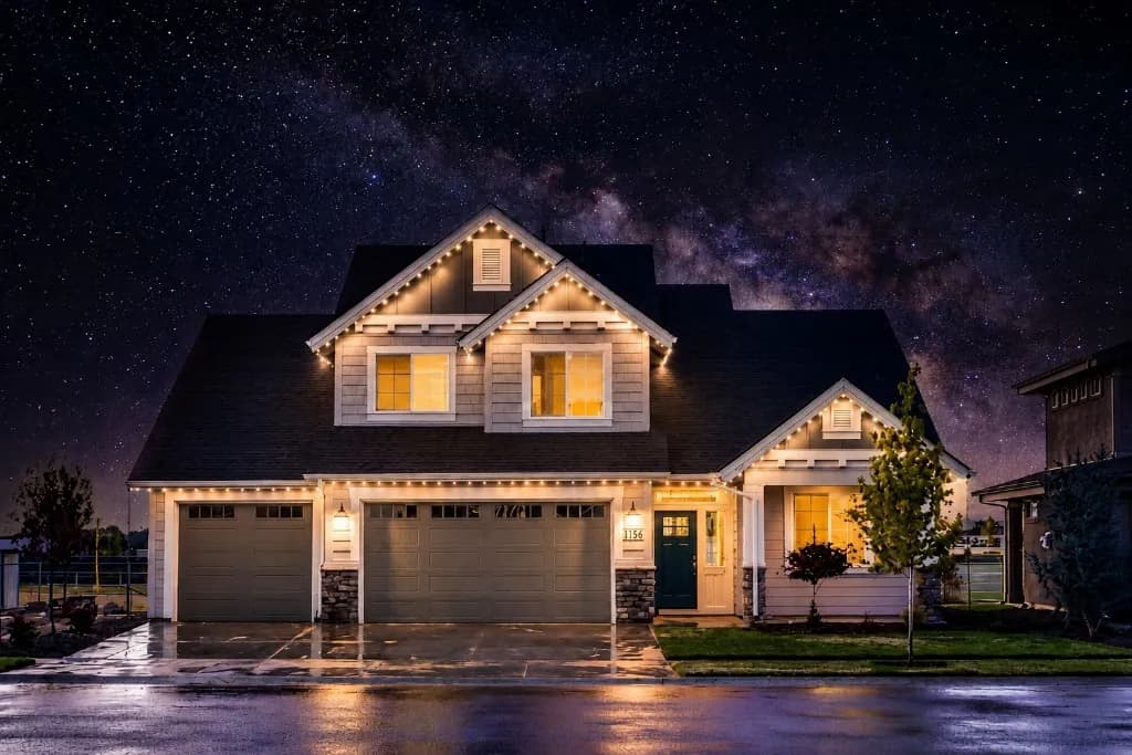 Warm White permanent roofline lighting on a home in the DMV at night — Light DMV