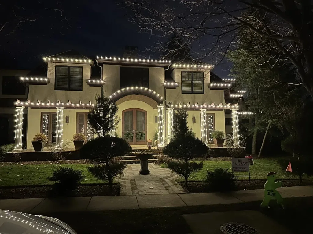 Christmas light installation in the DMV — icicle and roofline lighting in snow